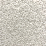 7. "Elegant cream and black pebble bench for relaxation"