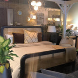 9. "Cane Oval Queen Bed with a medium-sized image, ideal for adding a touch of sophistication to your bedroom"