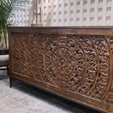 7. "Traditional sideboard with intricate carved patterns"