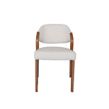 2. "Stylish wooden Paul Dining Chair with curved armrests and sleek design"
