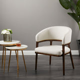 A fresh take on the traditional accent chair with soft ivory linen upholstered curves, Ash wood legs with walnut finish and Polished gold trim