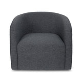 The Evita Swivel Chair in slate grey boucle. Its low profile makes it ideal for placement in a bedroom corner, a cozy reading nook, or as the perfect complement to your living room seating. Crafted in Europe and upholstered in a luxe boucle fabric, this barrel chair not only exudes sophistication but also boasts a hidden swivel base, allowing for subtle rotations around the room. Experience both style and functionality with this chic swivel chair designed to elevate the ambiance of any space in your home.