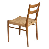 5. "Versatile Jakarta Dining Chair - Walnut/Natural Woven Seat for various interior styles"