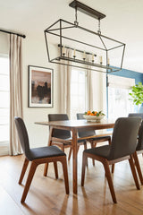 9. "Grey dining chair with ergonomic backrest and padded seat for ultimate comfort"