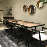 7. Antique-inspired Renaissance Dining Table - Black finish adds a touch of elegance