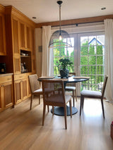 10. Oyster linen upholstered cane dining chair with a natural finish frame for a classic touch