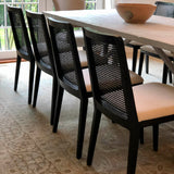9. Oyster linen dining chair with sturdy black frame