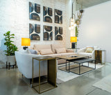 5. "Luxurious Tanner Sofa in leather upholstery with deep button tufting"