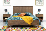 9. "Industrial West King Bed with metal frame and reclaimed wood accents"