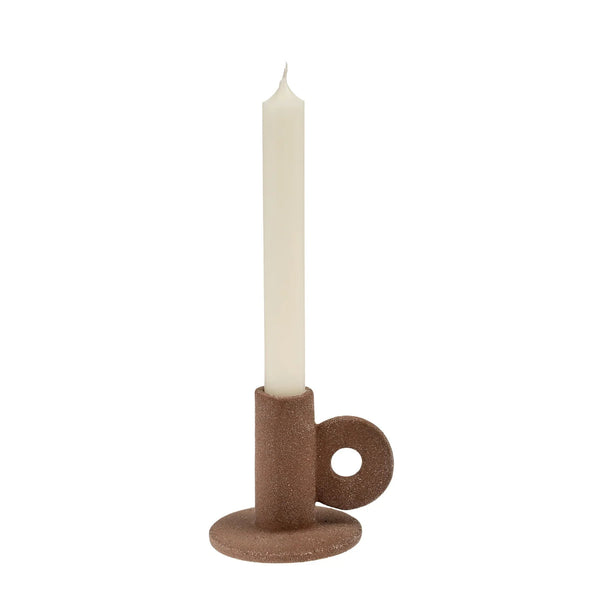 The Cruz Candle Holder is characterized by a contemporary shape and balanced with earthy texture and warm hued colours. Style it layered atop a decorative tray, books, or alone for a more minimal look. Complete it with a tapered candle for an inviting feel you will treasure year round.