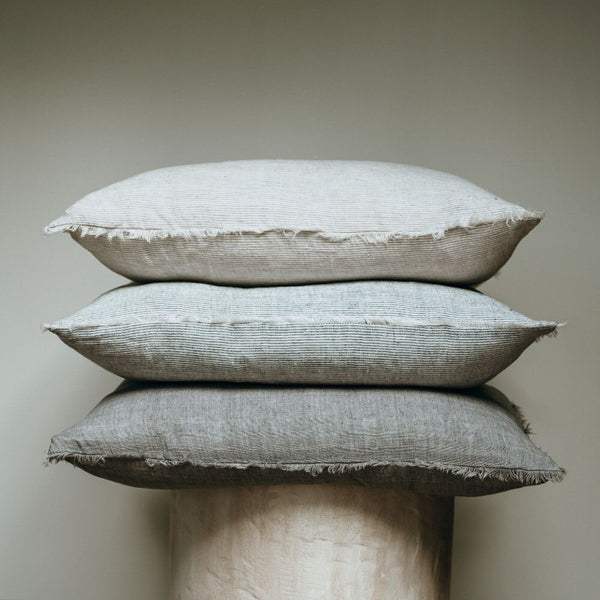 Classic linen pillow is updated with a frayed edge, making them beautiful standalone cushions or backdrops for layering. Complete with a premium feather down filler for fabulous fluff factor and comfort you'll want to sink your head into.