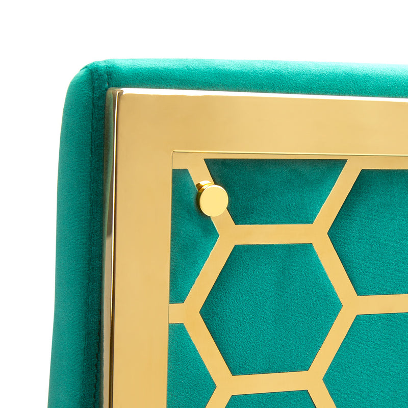 5. "Emerald green Riley Dining Chair: Elevate your dining room decor with this eye-catching piece"