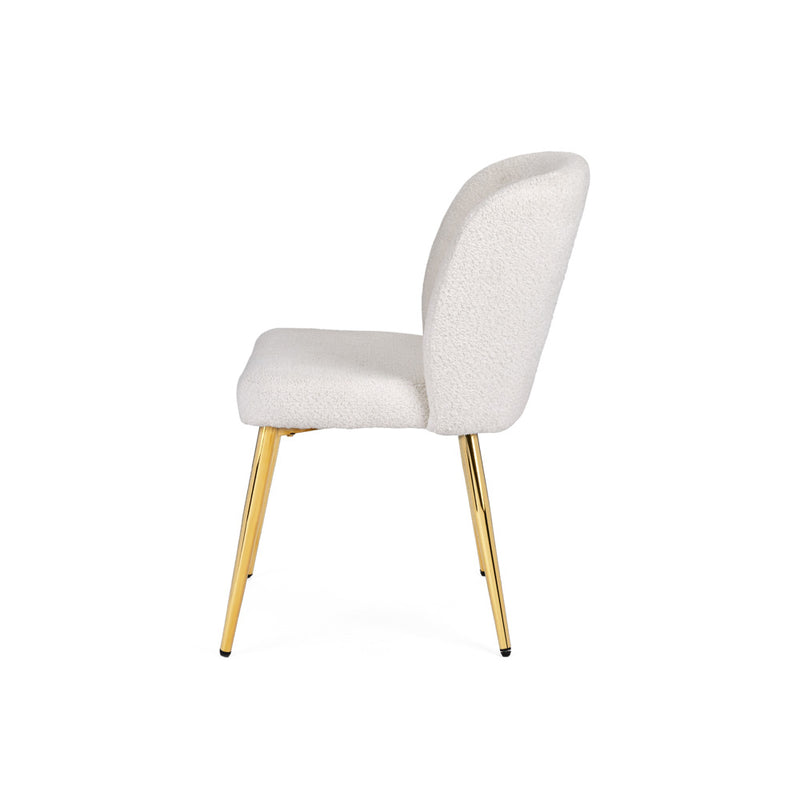 8. "Gold Leg Dining Chair with White Fur Fabric - Contemporary and Glamorous"