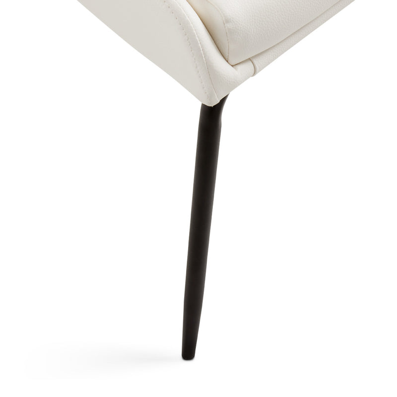 5. "Moira Black Dining Chair: White Leatherette - Luxurious and durable construction"