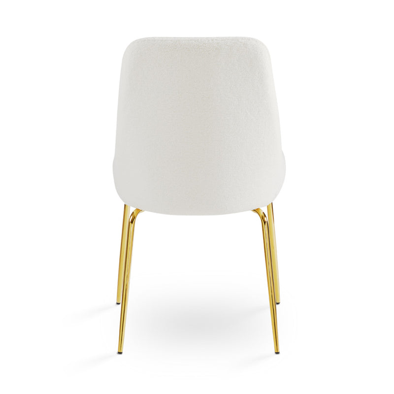 8. Moira Gold Dining Chair: Boucle Fabric Seat - Enjoy long hours of comfortable dining with this chair