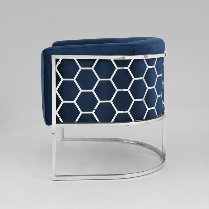 8. "Chic honeycomb chair in deep blue velvet for any space"