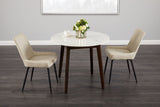 8. "Versatile image of Erin Round Dining Table - Complements various interior styles and color schemes"