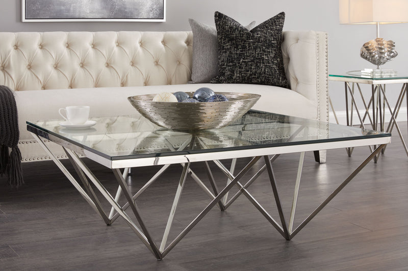 3. "Elegant Luxor Coffee Table with a rich walnut finish and contemporary X-shaped legs"