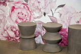 2. "Dark Grey Concrete Hourglass Side Table: Stylish and durable furniture for contemporary interiors"