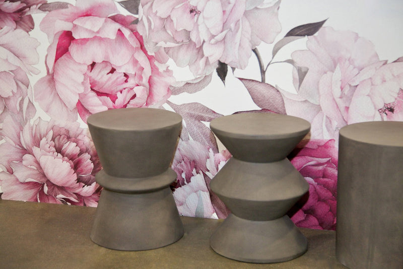 2. "Dark Grey Concrete Hourglass Side Table: Stylish and durable furniture for contemporary interiors"
