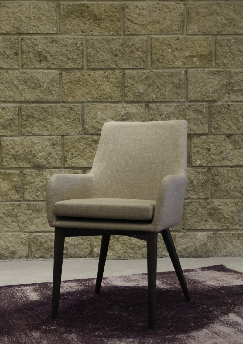 8. "Beige Fritz Arm Dining Chair with easy-to-clean fabric upholstery"