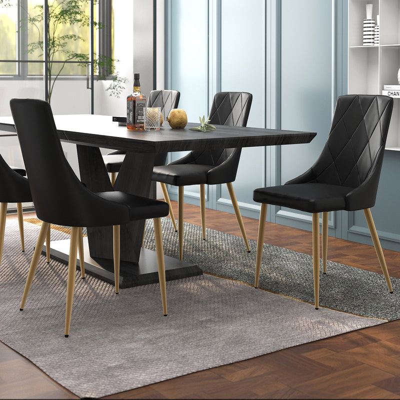 2. "Black and Aged Gold Dining Chairs - Perfect for Modern Interiors"