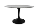 2. "White Marble Round Dining Table: Valencia table with a luxurious white marble top and sleek matte black base for a sophisticated dining experience."