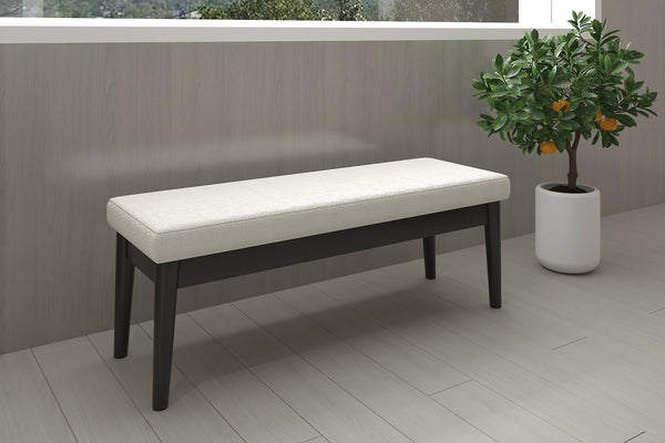 2. "Stylish cream and black bench with pebble design"