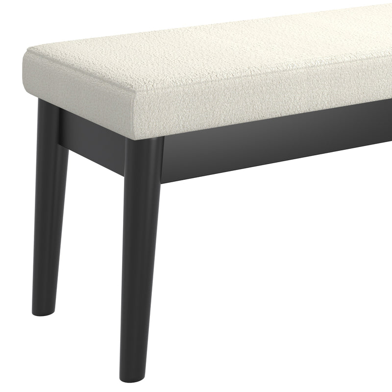 5. "Modern cream and black bench with pebble pattern"