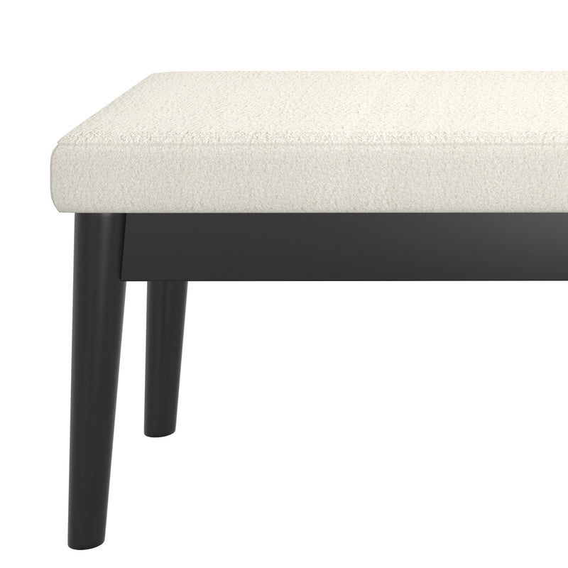 6. "Versatile cream and black bench for gardens and patios"