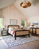 2. "Medium-sized image of Cane Oval Queen Bed showcasing its intricate cane detailing"