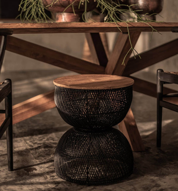 2. "Modern black side table with wave-shaped base"