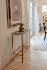 3. "Earth Wind & Fire Console Table: Grey marble top with sleek design for contemporary homes"