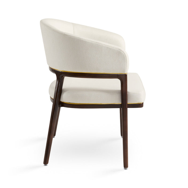 A fresh take on the traditional accent chair with soft ivory linen upholstered curves, Ash wood legs with walnut finish and  Polished gold trim