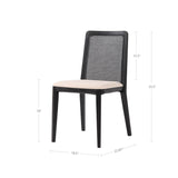 12. Black framed cane dining chair featuring oyster linen upholstery