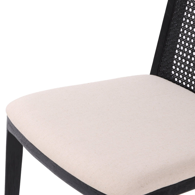7. Elegant cane dining chair with oyster linen upholstery and black frame