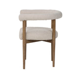 3. "Modern round dining chair with sleek design and metal legs"