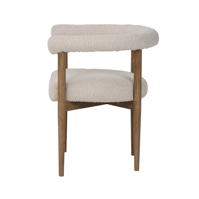 3. "Modern round dining chair with sleek design and metal legs"