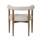 4. "Classic round dining chair with tufted upholstery and button accents"