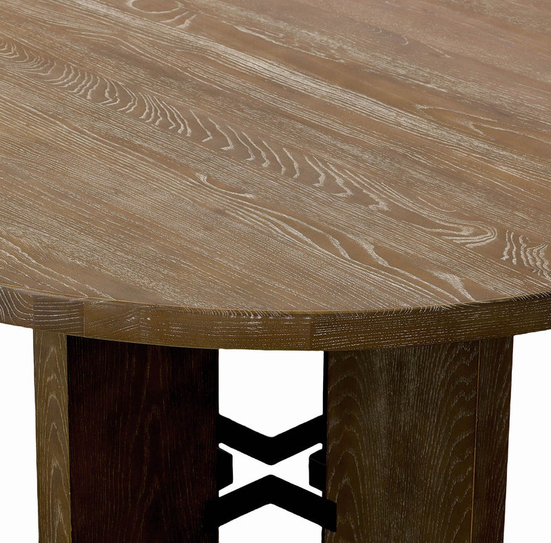 7. "Fraser Round Dining Table - Sleek and modern addition to your dining area"