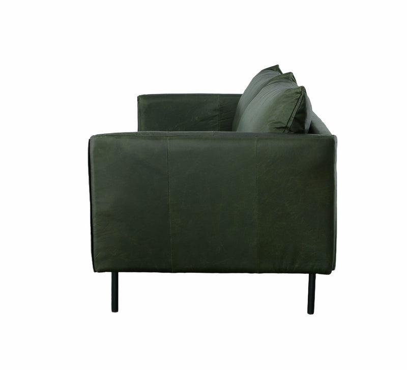 3. "Modern Forest Sofa - Moss Green in a contemporary interior"