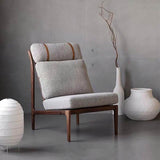 7. "Studio Accent Chair in neutral tones, perfect for blending with any decor"