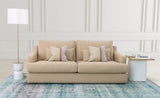 8. "Stylish Tanner Sofa in vibrant blue fabric with contrasting piping"