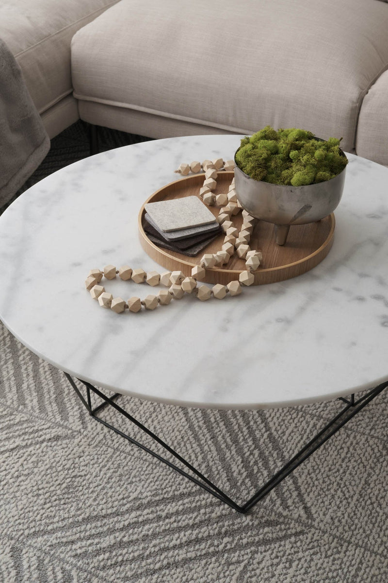 9. Add a touch of luxury with the Valencia Round Coffee Table - Grey Marble/Black Matte