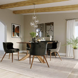 9. "Mila Dining Chair - Black Velvet featuring a timeless design that complements any decor"